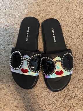 Alice + Olivia Black Slide Sandals with Holographic Face & Red Lip Accent